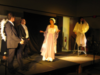Clarence, Scrooge, Mrs. Cratchit and an Angel on a ladder