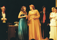 A butler in a Christmas cap, two women talking, a man in a beret, and two other women