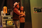 A man in a cowboy hat and vest and a woman in a gold Starfleet uniform