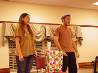 A young boy and girl singing