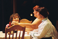 Three woman sitting at a table drinking