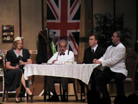 Three men and a woman sitting at a table